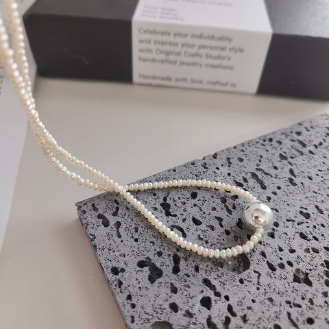 Lustrous Silver Ball Adorned Freshwater Pearl Necklace